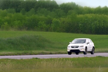 Fototapeta premium Adventure SUV with 4WD driving outdoors