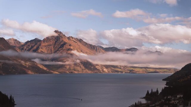 Timelapse of Low Cloud on Cecil Peak and Lake Wakatipu in Golden Autumn Light New Zealand