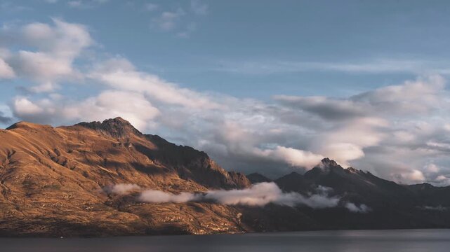 Timelapse of Cecil Peak and Lake Wakatipu with Dramatic Clouds in Autumn Queenstown New Zealand