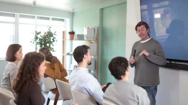 Teacher making presentation for students using digital board. High quality 4k footage