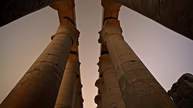 This clip features the Great Colonnade of Amenhotep III, a monumental processional avenue consisting of two rows of seven massive columns.