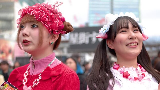 Two Young Women in Colorful Harajuku Decora Fashion Laughing Outdoors