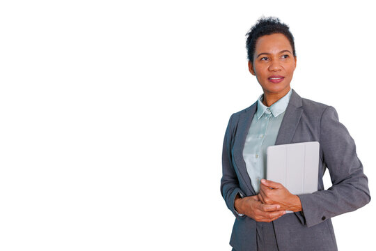 Confident businesswoman holding tablet, looking away with a visionary and professional expression, transparent background