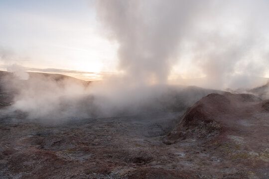 Dramatic geothermal steam vent at Sol de Manana geyser field in Bolivia during sunrise