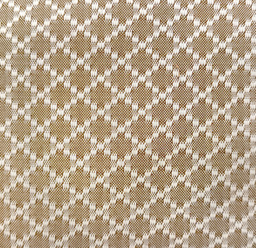 Close up of graphic background in random diamond pattern in white and brown color. Suitable for upholstery, wallpaper, and fabric. Seamless background texture.