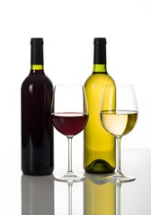 Obraz premium Red and white wine bottles with glasses on white background