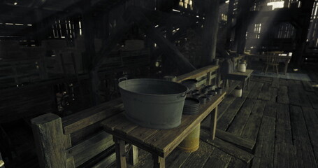 In a dimly lit barn, wooden furniture holds metal buckets and assorted tools, creating a nostalgic atmosphere. Rays of light filter through the rustic structure. © icetray