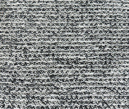Close up texture of grey boucle fabric in random grunge and dirt pattern. Curled knitted tufted texture. Suitable for sofa, upholstery, curtain, and drapery. Seamless background texture.