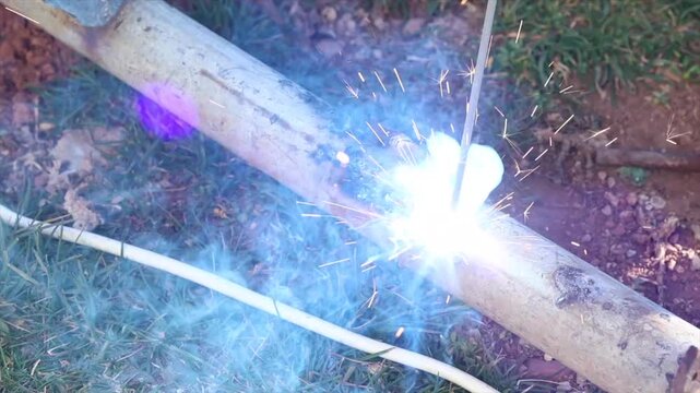 Welding process with bright sparks and smoke