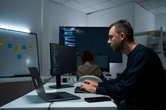 software developer talk strategy plan to executive write prompt AI bot IT app program data analytics in tech startup office.Projected visuals and glowing code on screen.AI chatbot technology concept