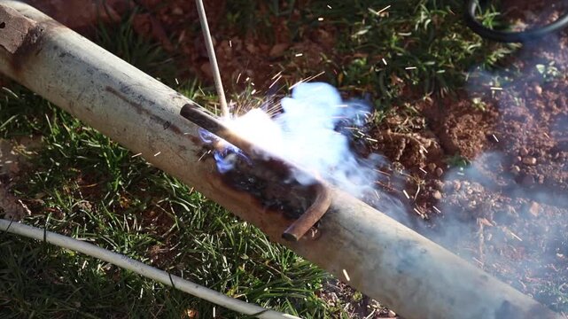 Welding process with bright sparks and smoke