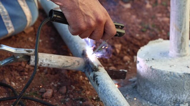 Welding process with bright sparks and smoke