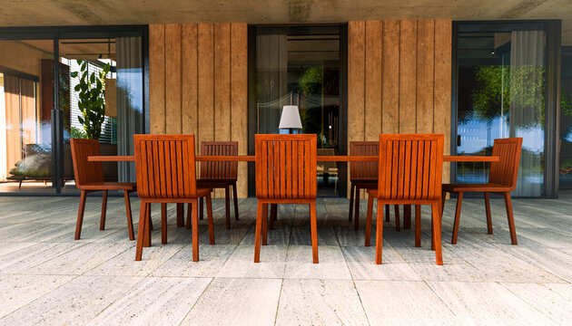 Modern wooden table and chairs on outdoor patio in tranquil garden