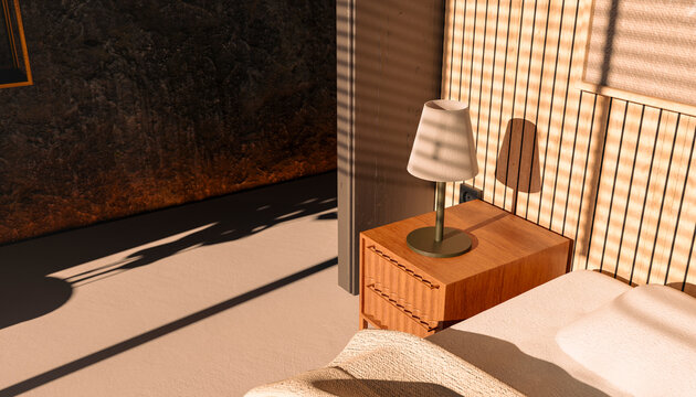 Sunlit bedroom interior with bedside table and lamp in morning light