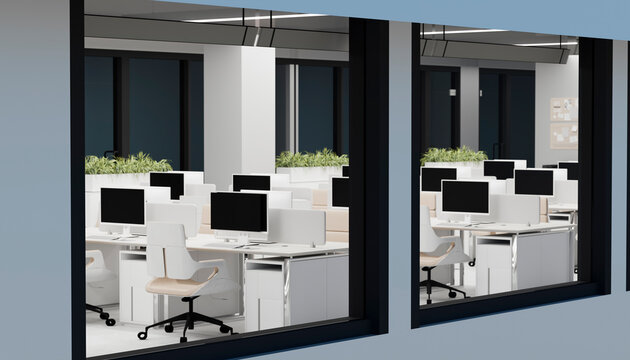 Modern open office interior with computer workstations and indoor plants