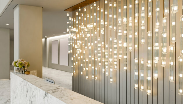 Modern hotel reception with minimalistic design and golden lighting