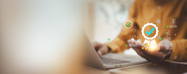 Businessman touching standard quality control , Businessman using digital interface showing certification badge, quality assurance, standards compliance, and excellence in performance.