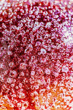 Macro close up of colorful pink and red abstract bubble texture