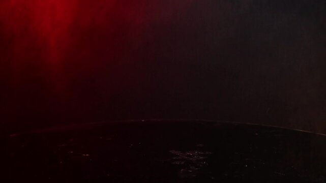 off-road toy cars turn with big tires art creative in water splashes 360 degree rotation on dark background with red backlight