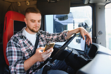 Truck driver using smartphone in vehicle