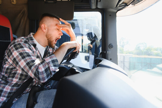 Truck driver yawning due to sleep deprivation and fatigue