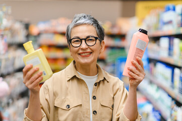 Happy woman shopping for beauty products in supermarket