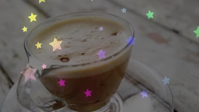 Camera zooming to espresso cup on tabletop, stars gliding over crema, shot serving coffee ad