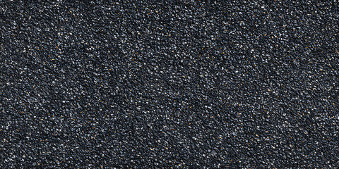 Fototapeta premium Dark asphalt surface ideal for roads or parking areas located in urban or rural settings during daylight