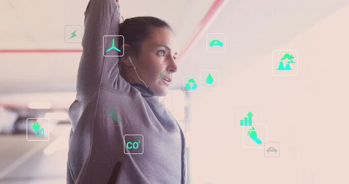 Woman holding arm, glancing right and causing floating energy icons while stretching for health