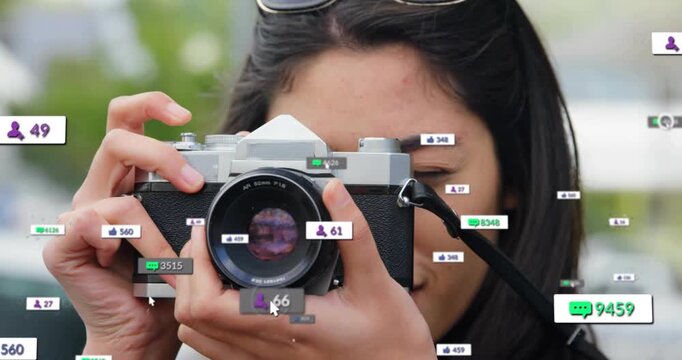 Woman photographer lifting vintage SLR, sparking social counters around lens while checking shots