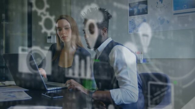 Two coworkers reviewing charts in business tapping pad activating animated data agreeing outcome