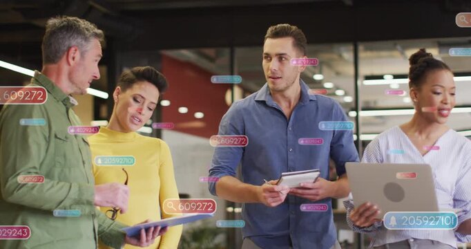 Team in office central man opening tablet and leading business sync with data badges over screens