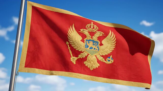 A red and gold flag with a double-headed eagle emblem flutters against a blue sky