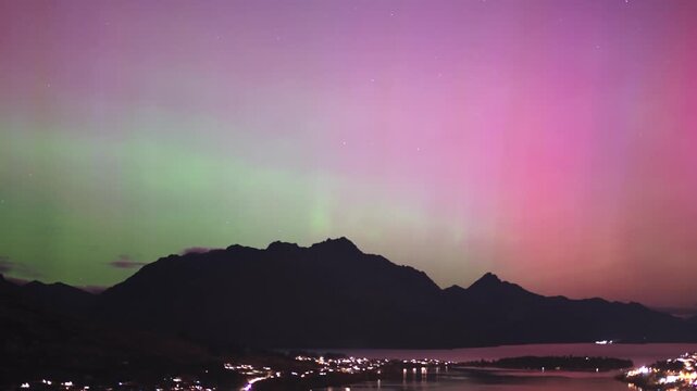 A timelapse of Aurora Australis Green and Magenta over Cecil Peak and Lake Wakatipu Queenstown New Zealand