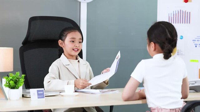 Young Asian Girl Roleplaying as a Businesswoman Conducting a Job Interview