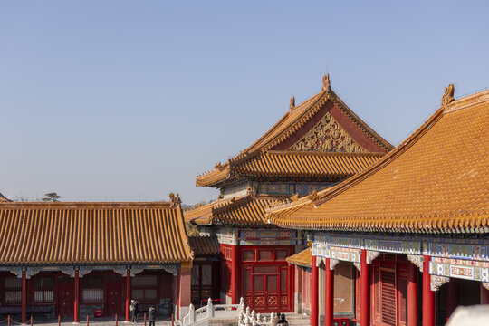 View of traditional Chinese architecture with vibrant red pillars and golden roofs under a clear sky, a timeless scene, Beijing, Beijing, China.