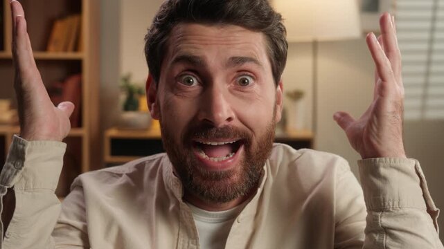 Portrait Caucasian middle-aged man looking at camera with shocked expression brain explosion burn head idea amazed reaction shock at home adult male showing blow mind gesture brainstorm overwhelmed