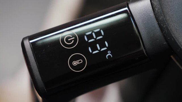 The electric kettle's touch panel displays water temperature, making it convenient for home use. High quality 4k footage