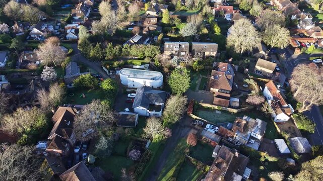 Overhead birds eye drone aerial houses Chalfont St Peter Buckinghamshire UK