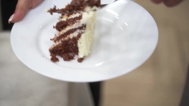 female and male hands cutting a wedding cake
