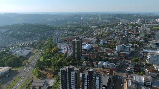 Bento Gon&ccedil;alves urban aerial flight over neighborhoods, avenues and hillside cityscape, captured in D-Log with 10-bit color using a Hasselblad sensor.