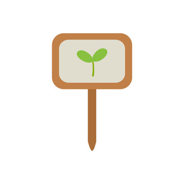 Wooden garden label with green sprout. Spring garden design element.