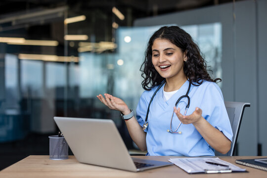 Female doctor providing telehealth consultation using laptop