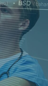 Vertical video: Camera panning, MD in blue scrubs turning head, tracking stethoscope for data, YEN