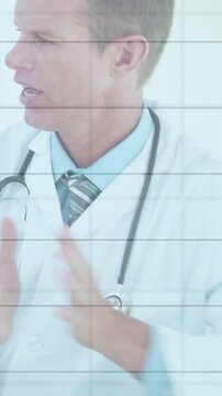 Vertical video: Medical doctor wearing stethoscope hearing patient, glancing chart and consulting