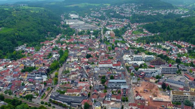 An aerial view around the old town in the city Merzig in the country of Germany on a cloudy spring afternoon .