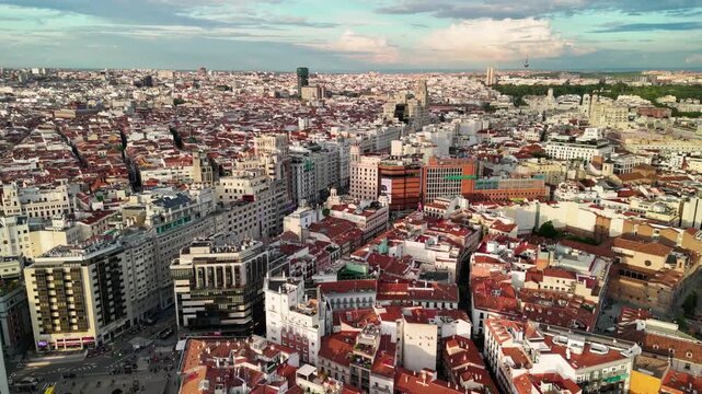 Aerial view of Madrid, Spain skyline with dense urban architecture, residential districts and modern cityscape under cloudy sky, showcasing European capital life, travel, real estate and city footage.