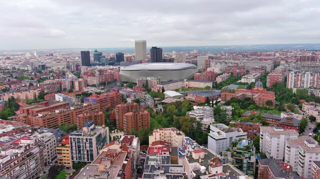 MADRID,SPAIN: Aerial view of the iconic Bernab&eacute;u football stadium, home of Real Madrid with its striking modern exterior, ideal for travel, sports or city footage.