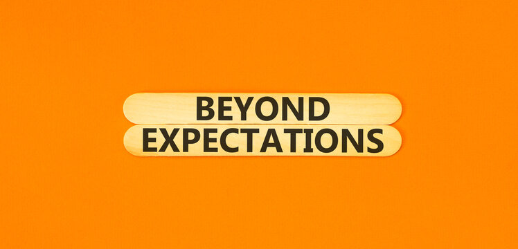 Beyond expectations words symbol. Concept words Beyond expectations on beautiful wooden sticks. Beautiful orange background. Business and Beyond expectations words concept. Copy space.