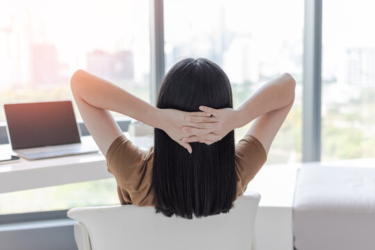Work -life balance, living quality and carefree mental health concept with young woman take it easy resting in luxury business city hotel or at home office with computer pc laptop on lap